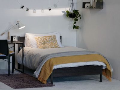 steel bed with wooden headboard