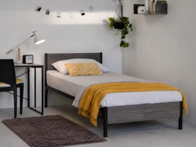 steel bed with wooden headboard