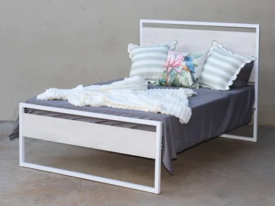 Zhara steel bed with Lockeport wood panel headboard and footend – White Ferrograin frame, angled view